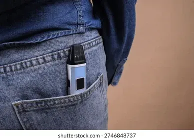 closeup vape device jeans pock