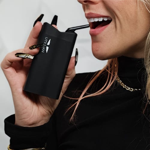 A person smoothly taking a puff from a sleek, buttonless draw-activated vape, emphasizing the effortless, hands-free experience and minimalist interaction.